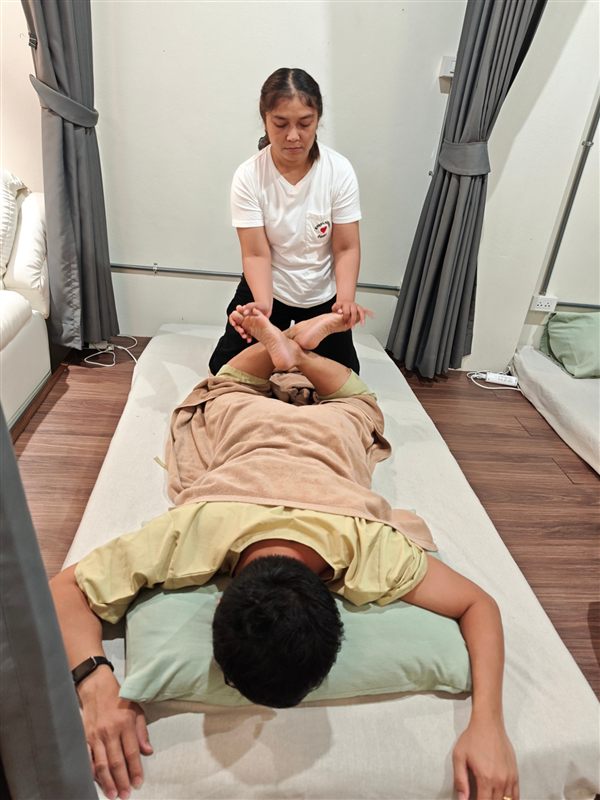 Thai massage leg stretch